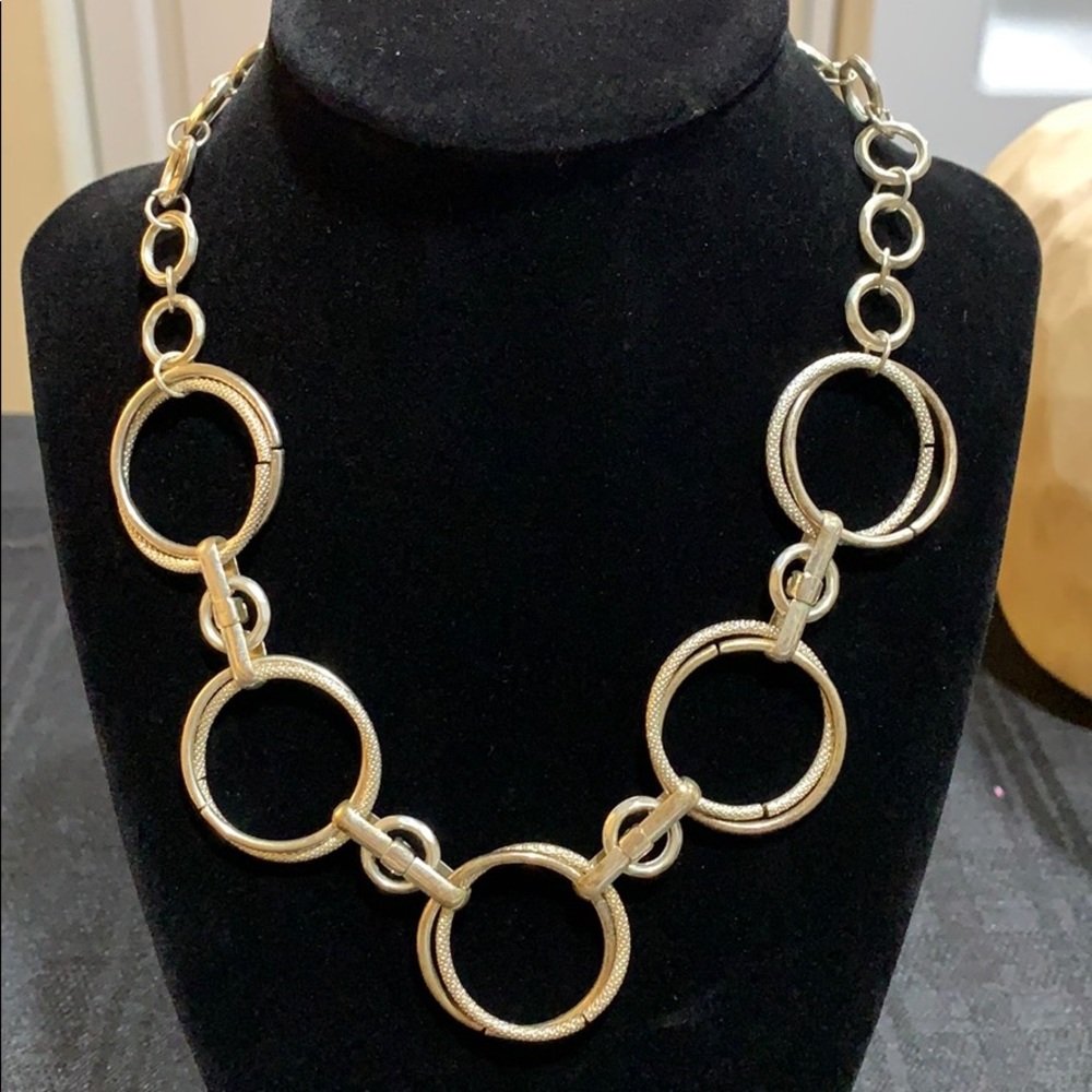 Silver toned necklace with 5 double hoops